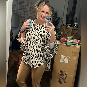 Leopard/Cheetah over sized ponchos type shirt with ruffle sleeves.